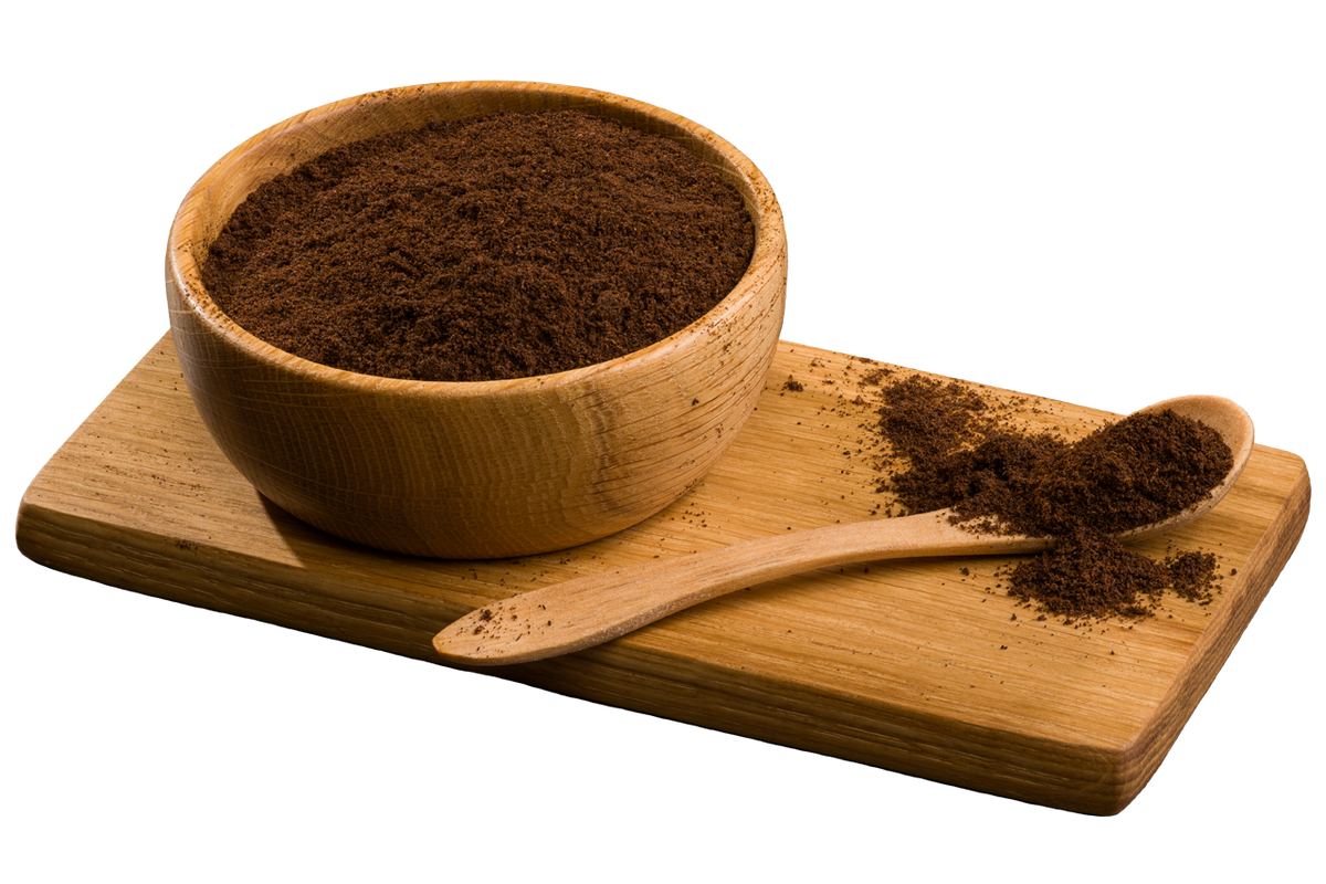 Premium Grade A Madagascar Bourbon vanilla powder in a wooden bowl and spoon on a wooden board.