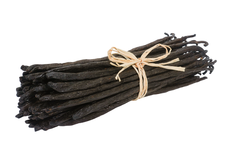 Madagascar Bourbon TK vanilla beans bundled with natural raffia, showing their long, dark brown pods and slightly wrinkled texture.
